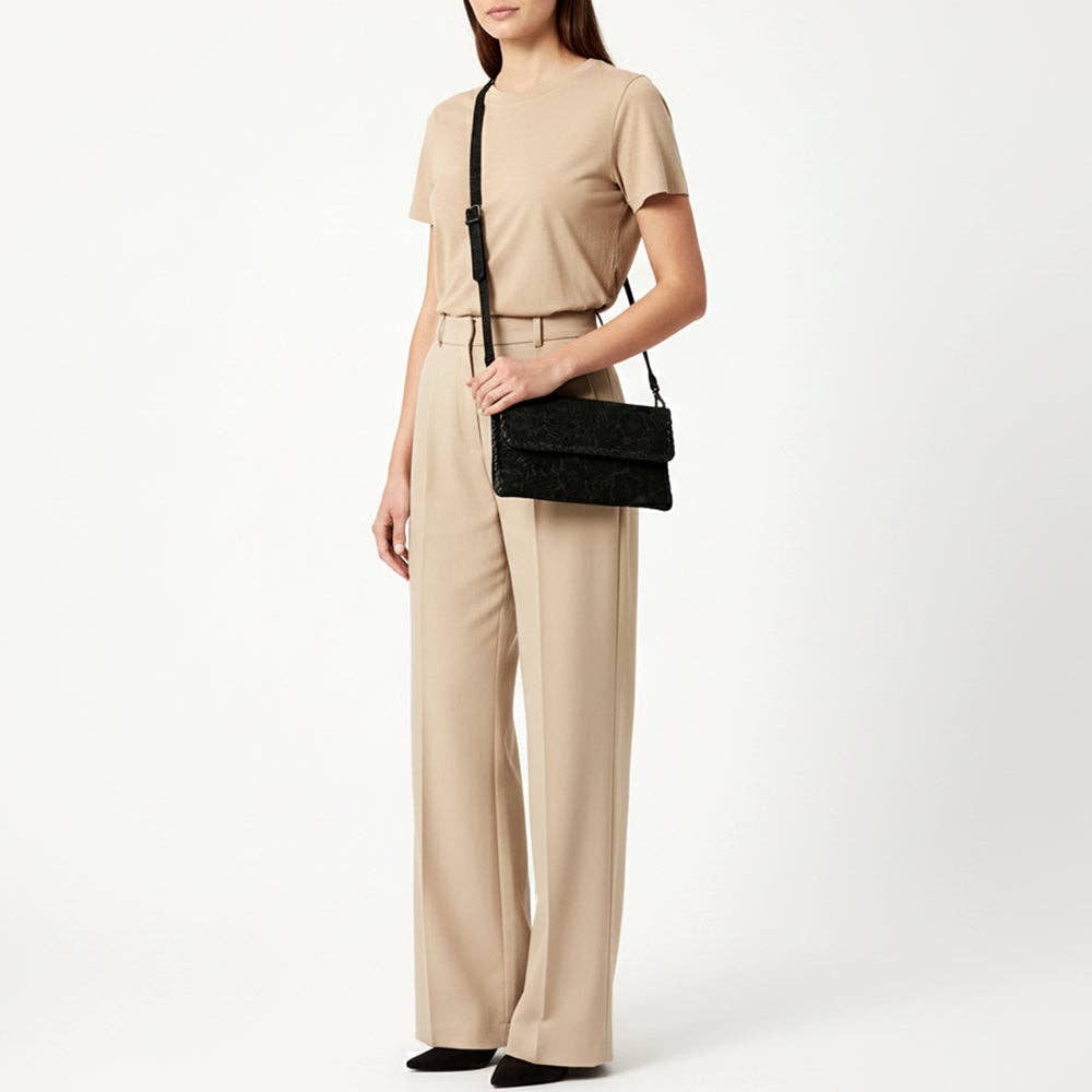 Black Floral Embossed Leather Crossbody Bag with Whipstitch Trim: ADBG1645