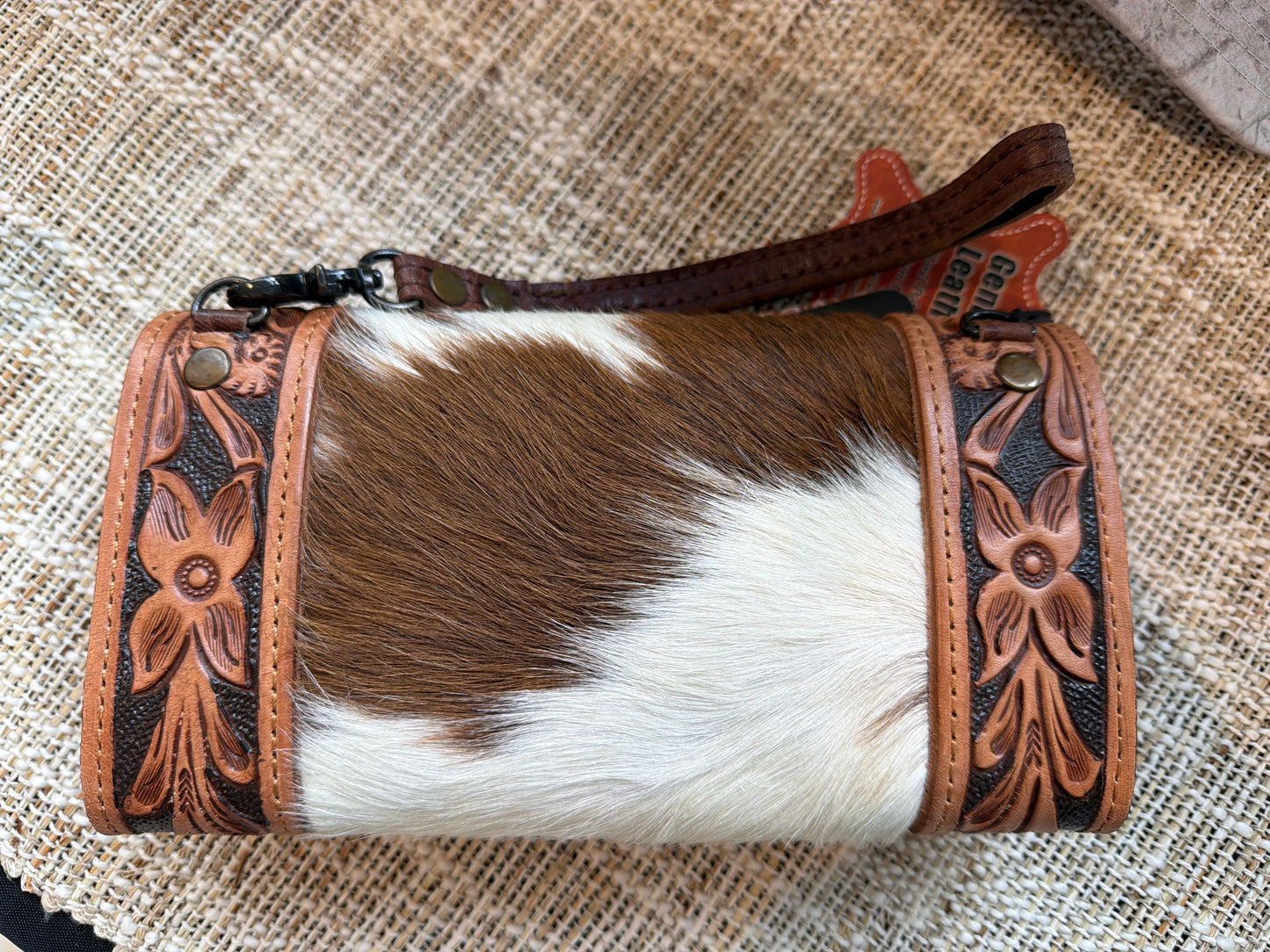 Cowhide Wallet with crossbody strap and wristlet.